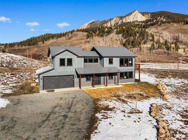 family setting up their new home amidst mountain scenery in Crested Butte CO